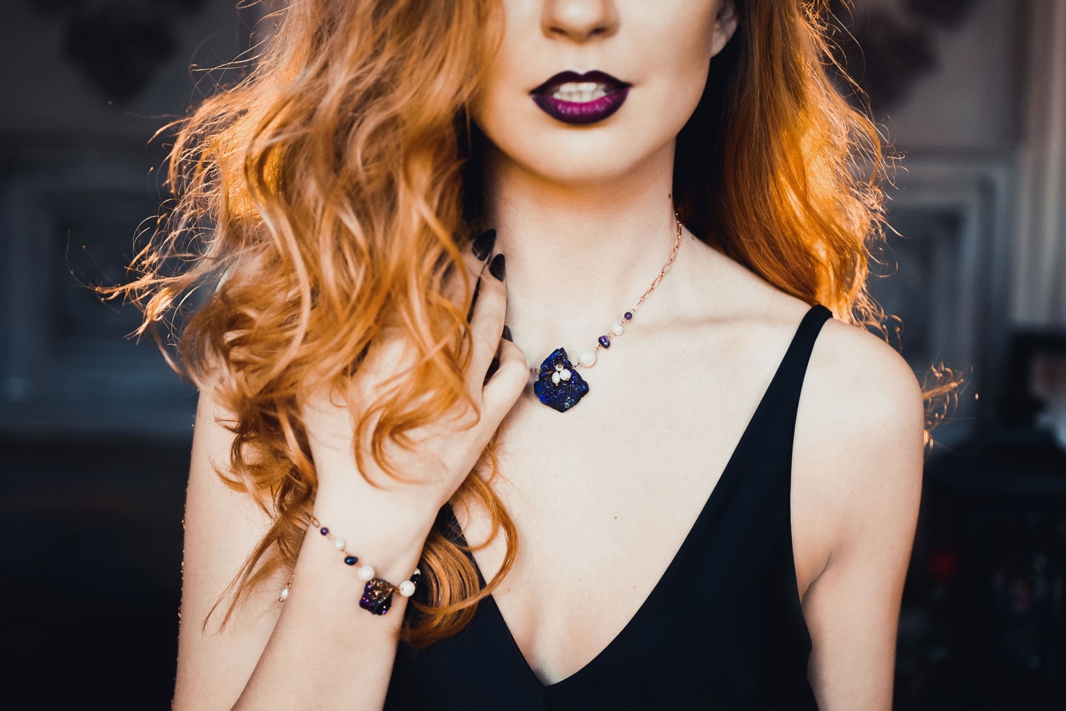 Woman with copper waves and dark lipstick